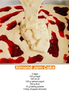 Delicious Almond Jam Cake topped with fresh jam and almonds