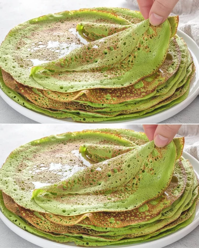 Healthy avocado oat pancakes stacked on a plate with syrup and berries