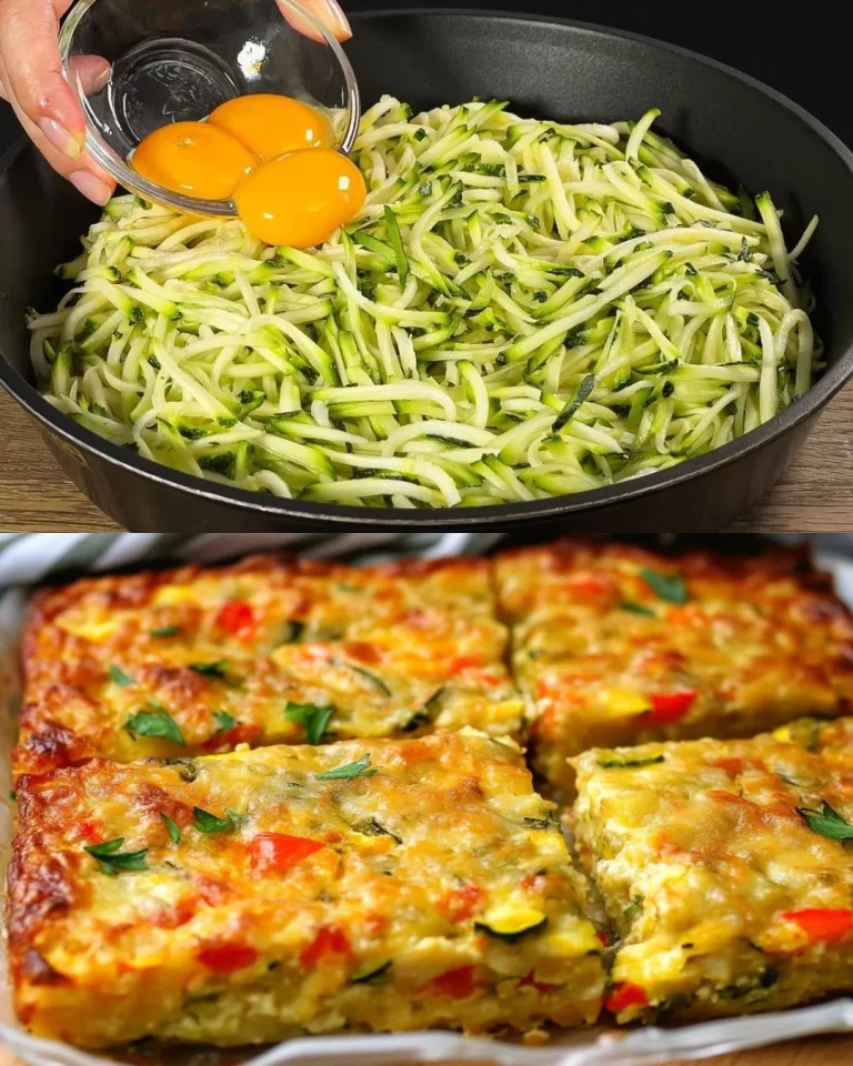 Baked vegetable and cheese frittata with garlic cream topping served on a plate