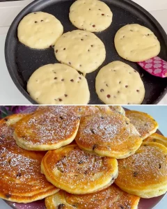 Fluffy homemade yogurt pancakes stacked on a plate with syrup and berries