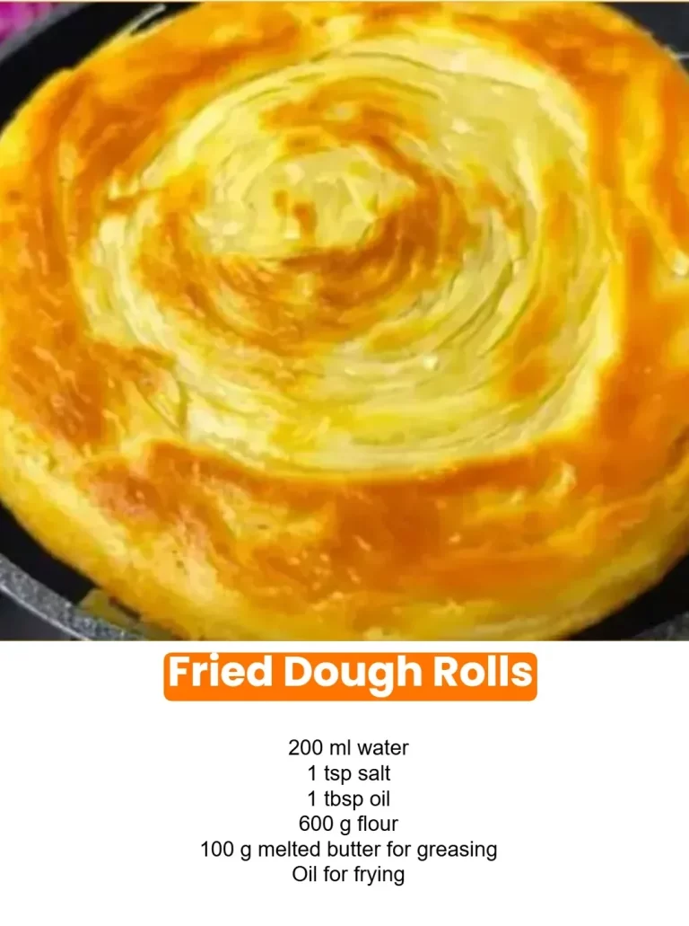 Golden fried dough rolls served with a dusting of powdered sugar.