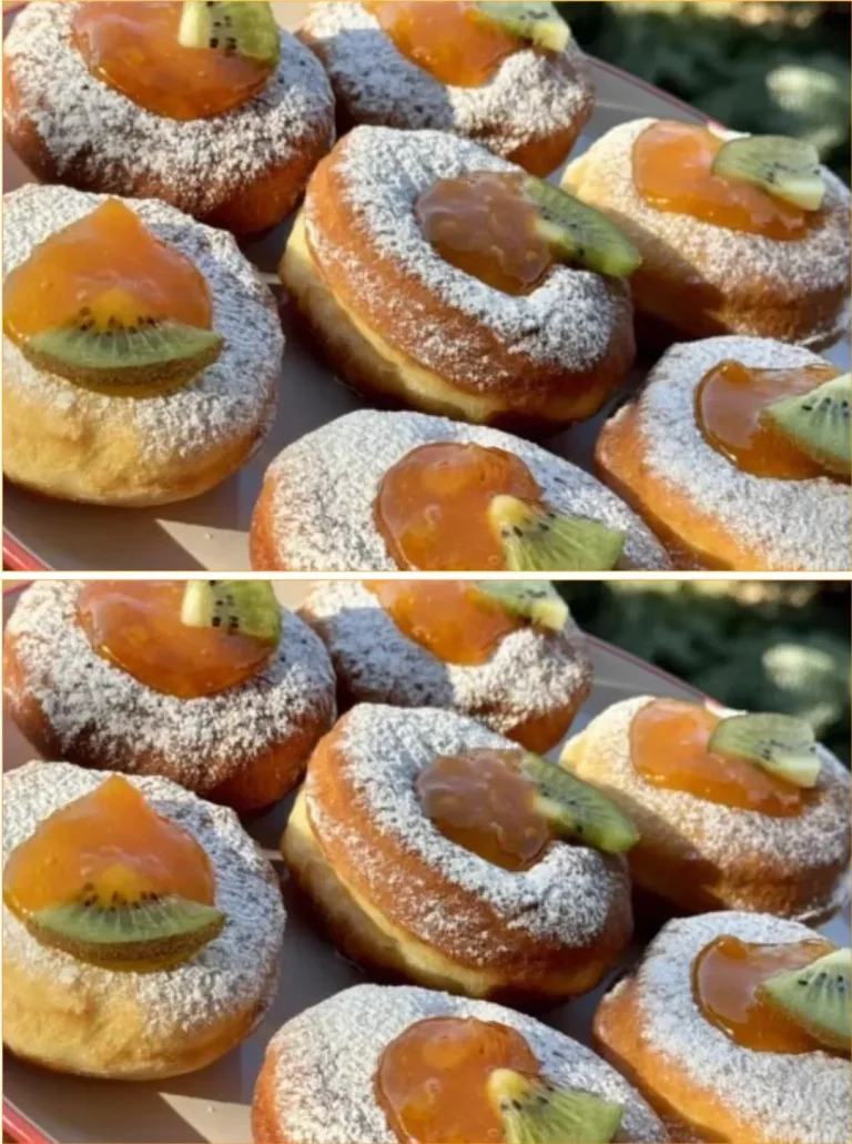 Delicious homemade yeast donuts filled with jam on a plate