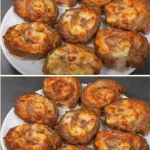 Delicious minced meat snails served on a plate, garnished with herbs.