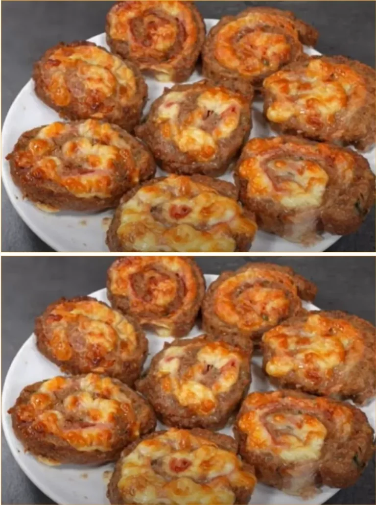 Delicious minced meat snails served on a plate, garnished with herbs.