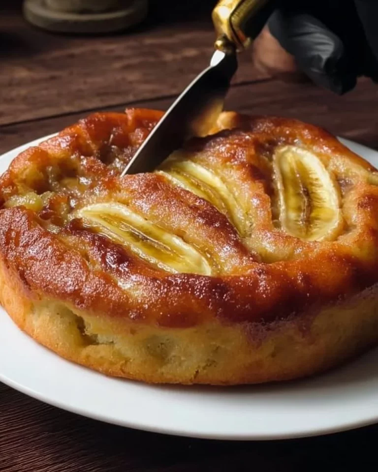 Delicious no oven banana cake topped with fresh banana slices and whipped cream