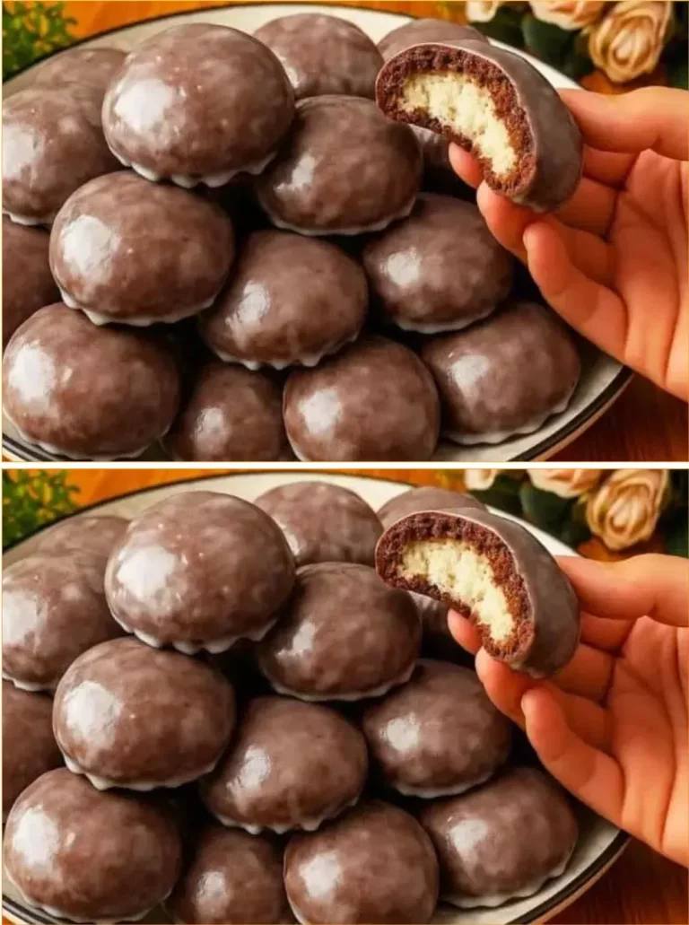 A plate of traditional Polish cookies with powdered sugar topping.
