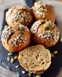 Soft and healthy lentil bread rolls on a wooden table