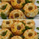 Zucchini and potato pancakes stacked on a plate, garnished with herbs.