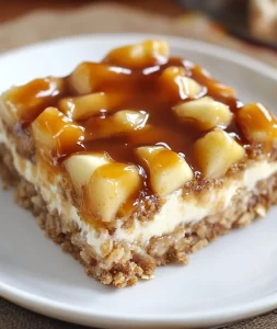 Delicious apple cheesecake bars topped with fresh apple slices