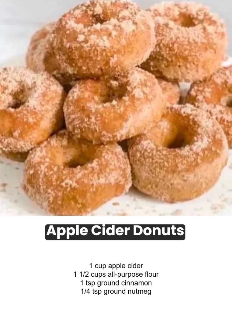 Freshly baked apple cider donuts sprinkled with cinnamon sugar