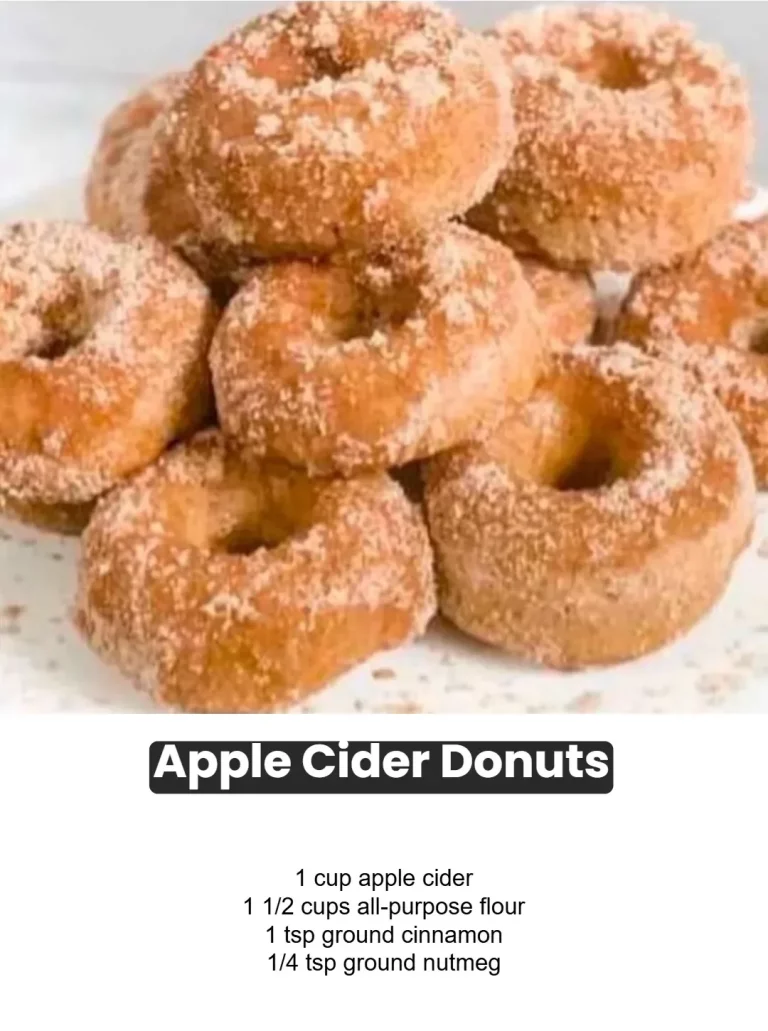 Freshly baked apple cider donuts sprinkled with cinnamon sugar