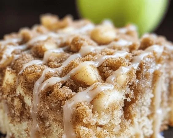 Delicious Apple Crumb Cake with a golden crumb topping and fresh apple slices