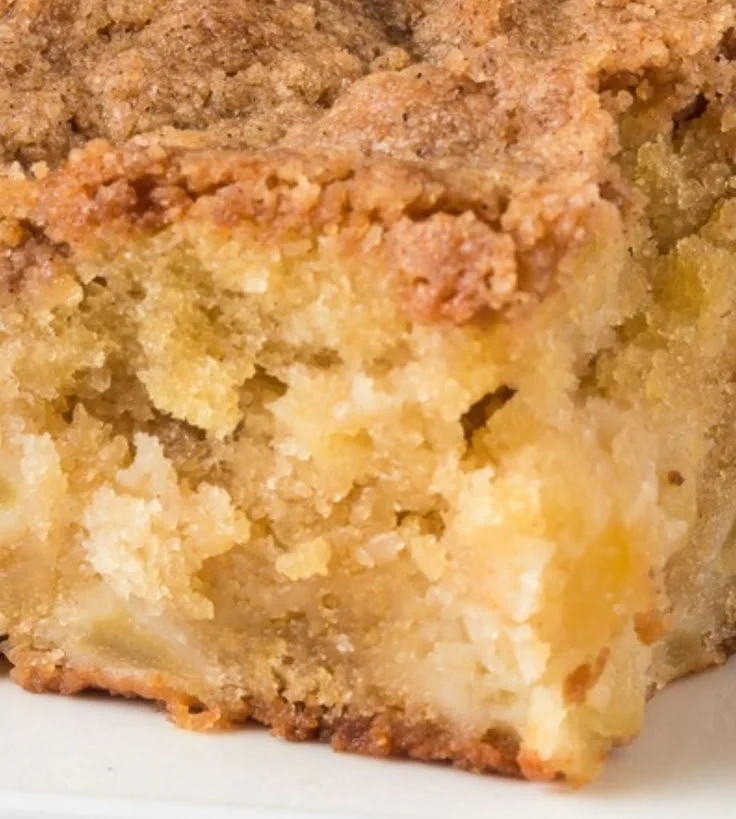 Delicious Apple Crumb Cake with a buttery crumb topping and fresh apples.