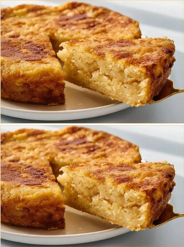 Slice of apple oat crumble cake topped with a crunchy oat topping on a plate