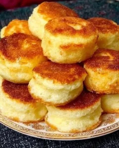 Delicious apple pancakes filled with fresh fruits on a plate