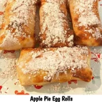 Apple Pie Egg Rolls served on a plate with cinnamon and apples