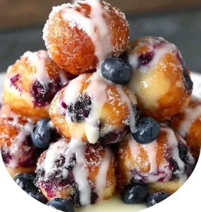 Baked blueberry fritter bites on a plate