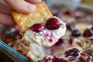 Delicious Baked Cranberry Cream Cheese Dip with festive toppings