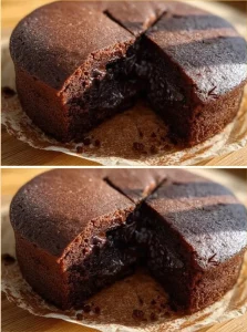 Delicious chocolate cake with chocolate chips on a decorative plate.