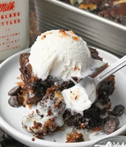 Delicious Chocolate Earthquake Cake topped with chocolate frosting and cream cheese