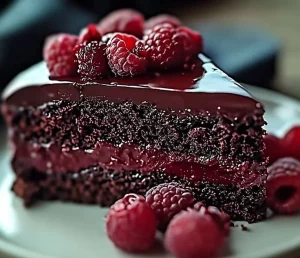 Delicious Chocolate Raspberry Cake with chocolate frosting and fresh raspberries