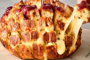 Warm Cranberry Brie Pull-Apart Bread with melted cheese and cranberries