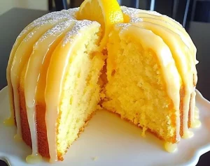 Deliciously moist lemon cake with lemon frosting and fresh lemon slices