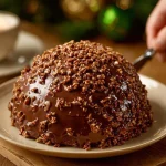 Delicious Ferrero Chocolate Cake topped with hazelnuts and chocolate frosting, beautifully presented.