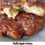 Delicious fluffy apple fritters dusted with powdered sugar