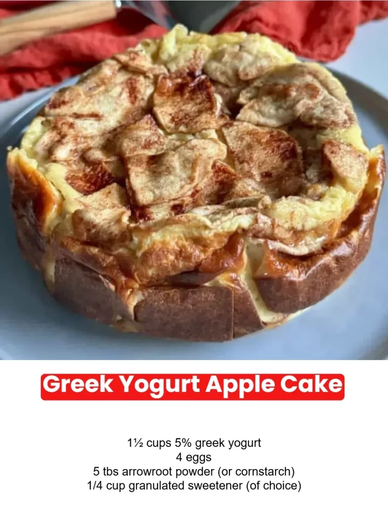 Slice of Greek Yogurt Apple Cake topped with apple slices and yogurt drizzle.