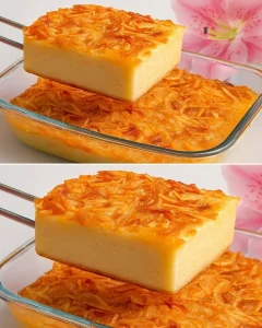 Slice of Oatmeal Banana Apple Cake topped with nuts on a wooden table