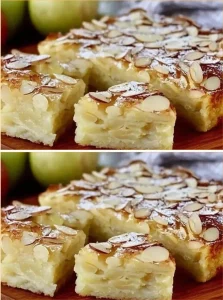 A delicious slice of quick and creamy apple cake topped with fresh apples and cream.