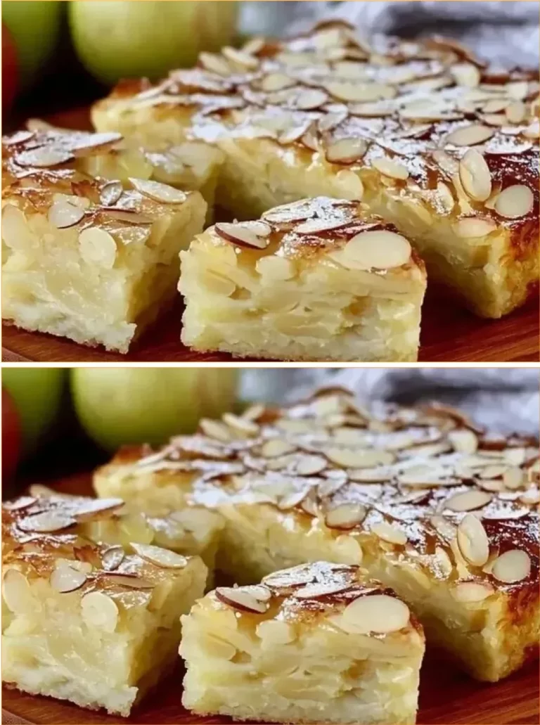 A delicious slice of quick and creamy apple cake topped with fresh apples and cream.