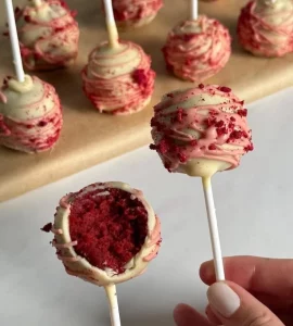 Homemade Red Velvet Cake Pops on a decorative platter