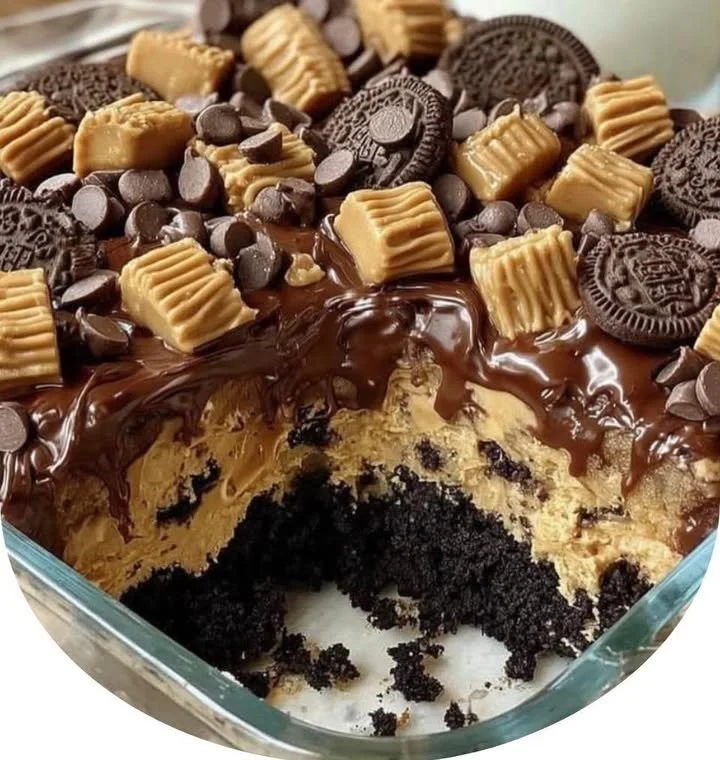 Delicious Reese's Peanut Butter Earthquake Cake topped with chocolate and peanut butter.