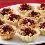 Savory cranberry and cheese bites on a platter, perfect for appetizers.