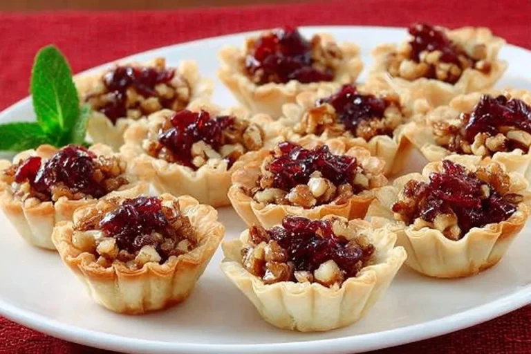 Savory cranberry and cheese bites on a platter, perfect for appetizers.