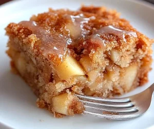 Delicious sweet apple fritter cake topped with cinnamon glaze