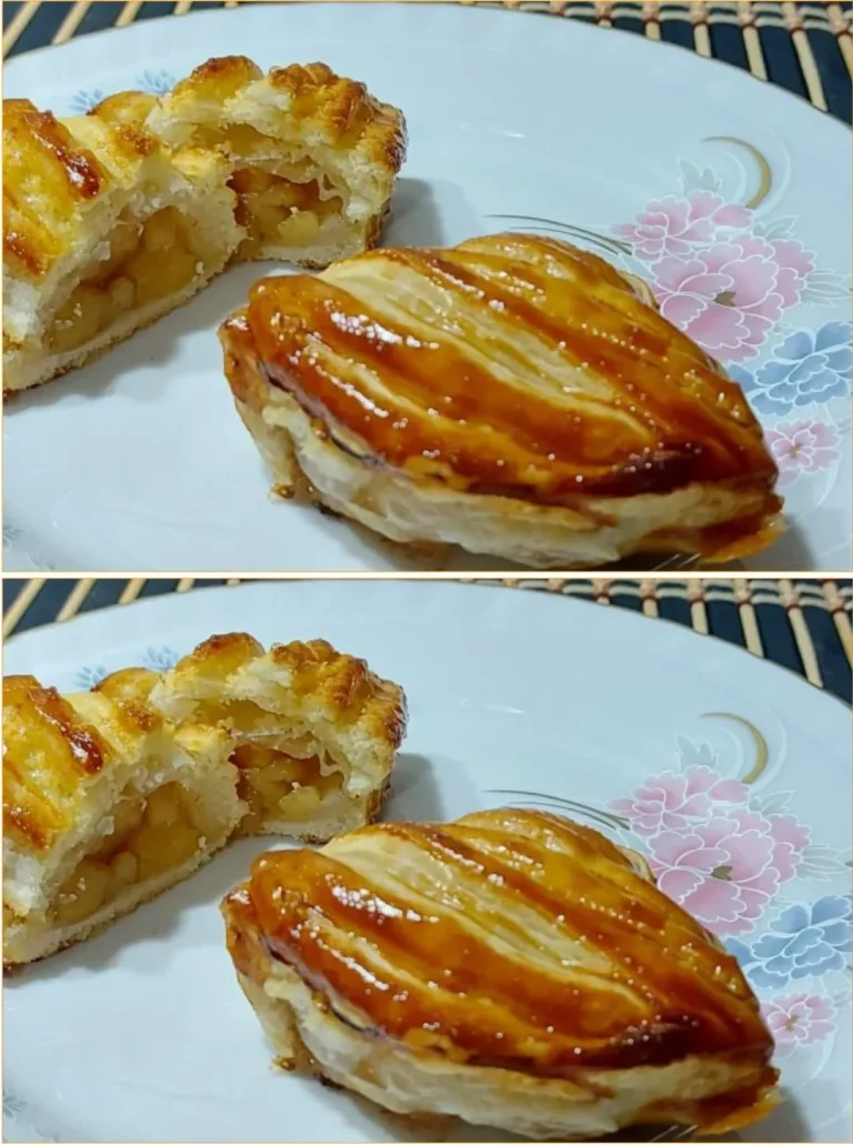 Freshly baked apple pastries golden brown with flaky crust and apple filling