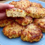 Cooked chicken fillet sizzling in a skillet with herbs