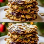 Crispy almond seed chocolate cookies on a plate with chocolate chips