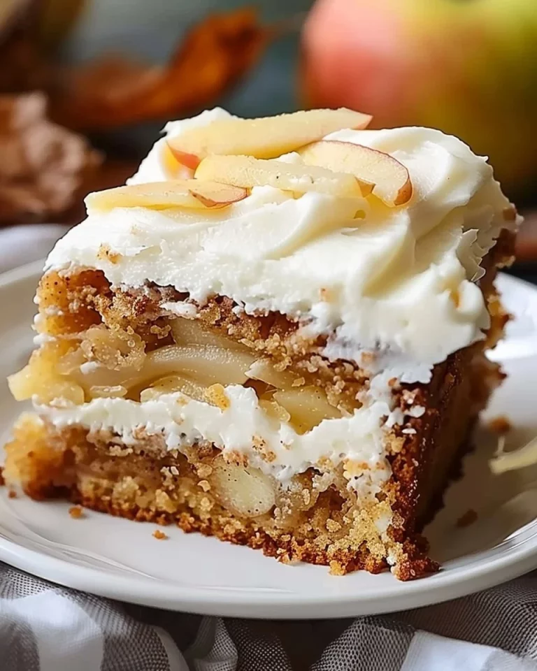 Slice of healthy German apple cake topped with apple slices and cinnamon