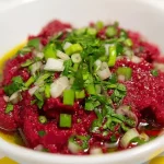 Delicious roasted beetroot spread served on toasted bread.