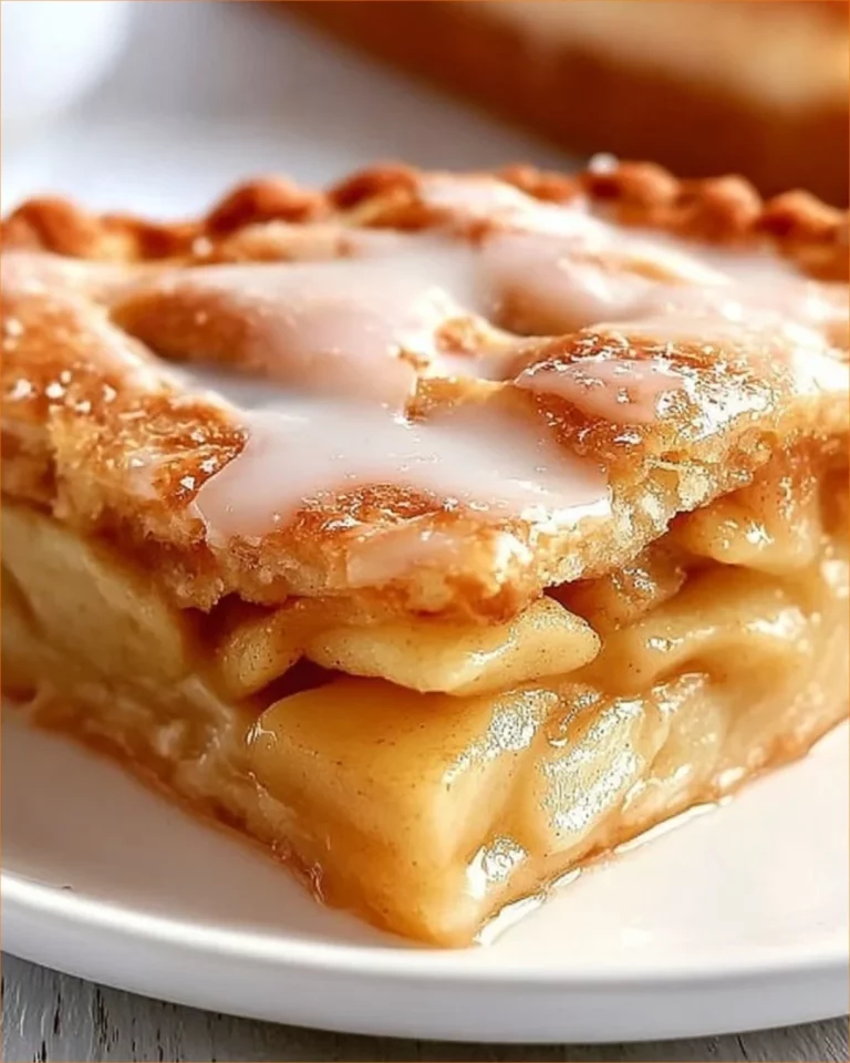 Buttery crescent roll apple pie freshly baked with golden crust and apple filling.