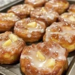 Delicious homemade apple fritters topped with icing and cinnamon sugar