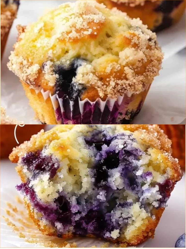 Freshly baked blueberry muffins with a golden top and juicy blueberries