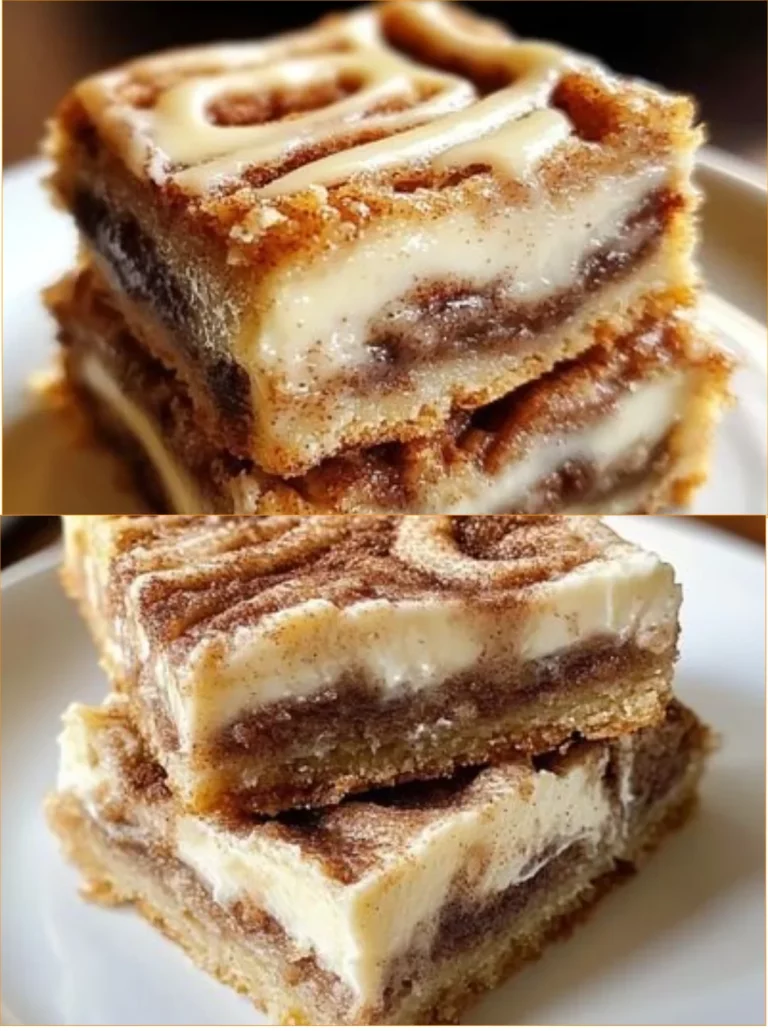 Delicious Cinnamon Roll Bliss Bars drizzled with frosting on a white plate