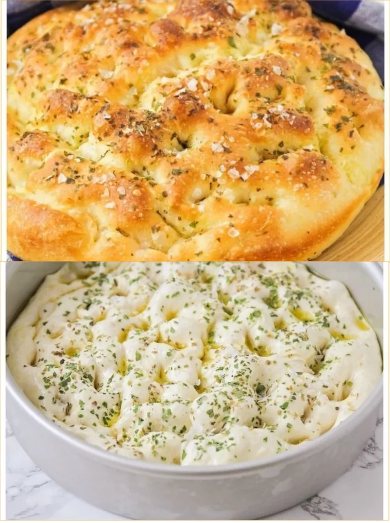 Fluffy herb focaccia bread fresh out of the oven, garnished with herbs.