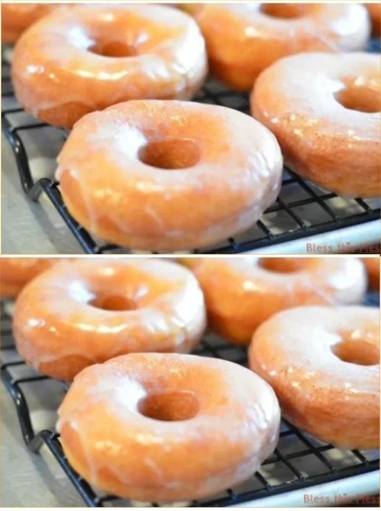 Freshly baked glazed donuts with a sweet glaze on top