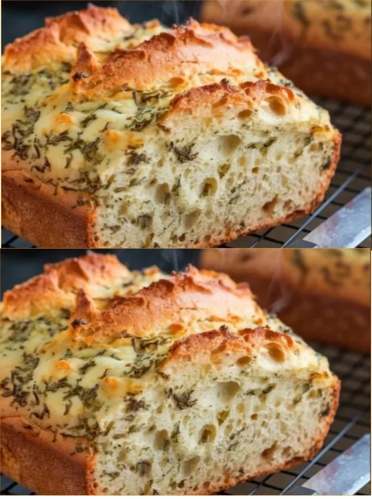 Freshly baked Italian Herbs and Cheese Bread loaf on a wooden cutting board.